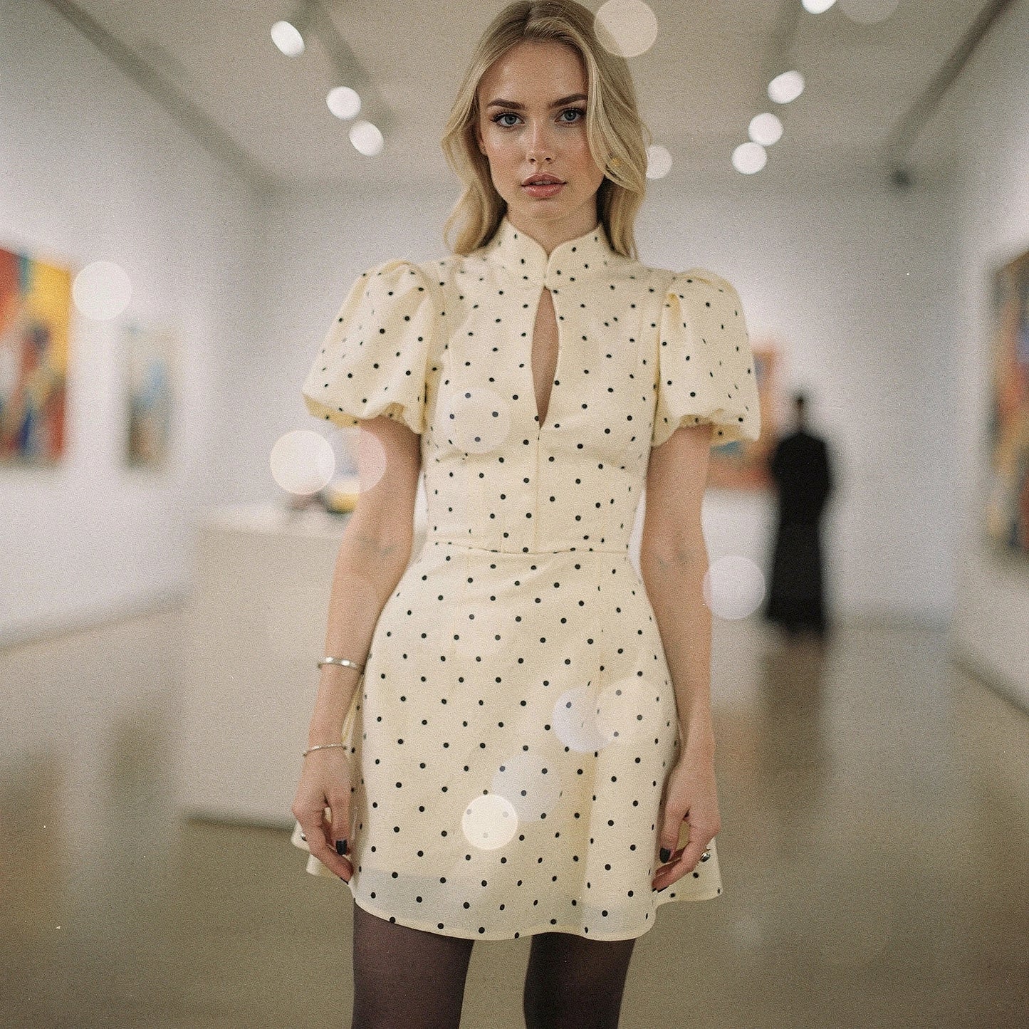 Elegant mini dress in soft fabric featuring playful ruffles and a vibrant floral pattern, view