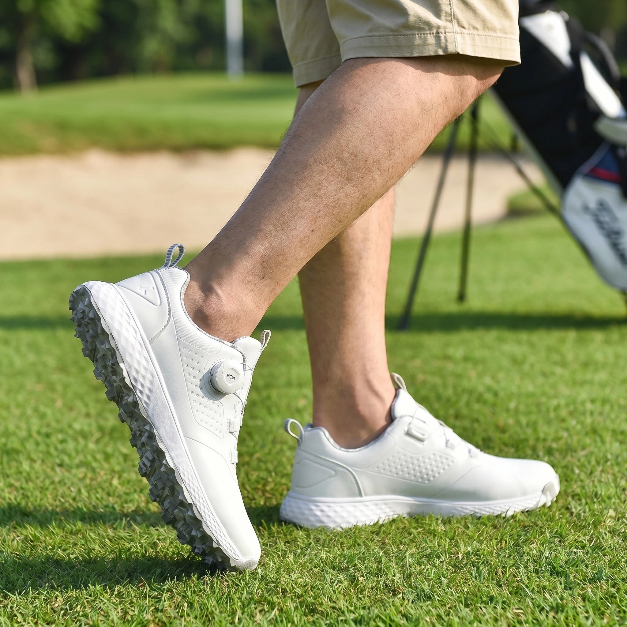 Close up view showing the durable waterproof fabric and intricate stitching of the men's casual golf sneakers in a sleek black design.