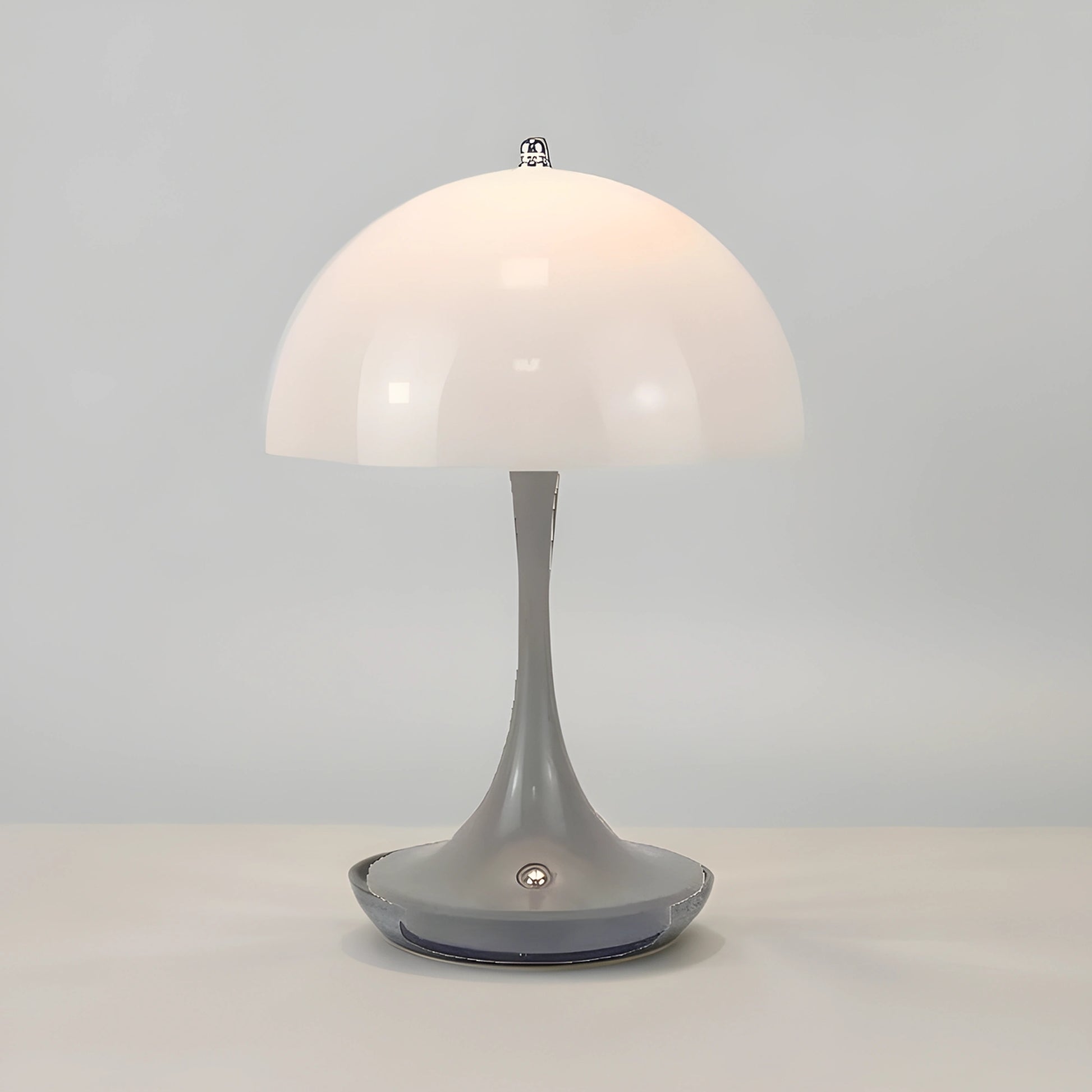 View of a sleek contemporary rechargeable table lamp in a warm metallic finish, featuring a minimalist design and soft light
