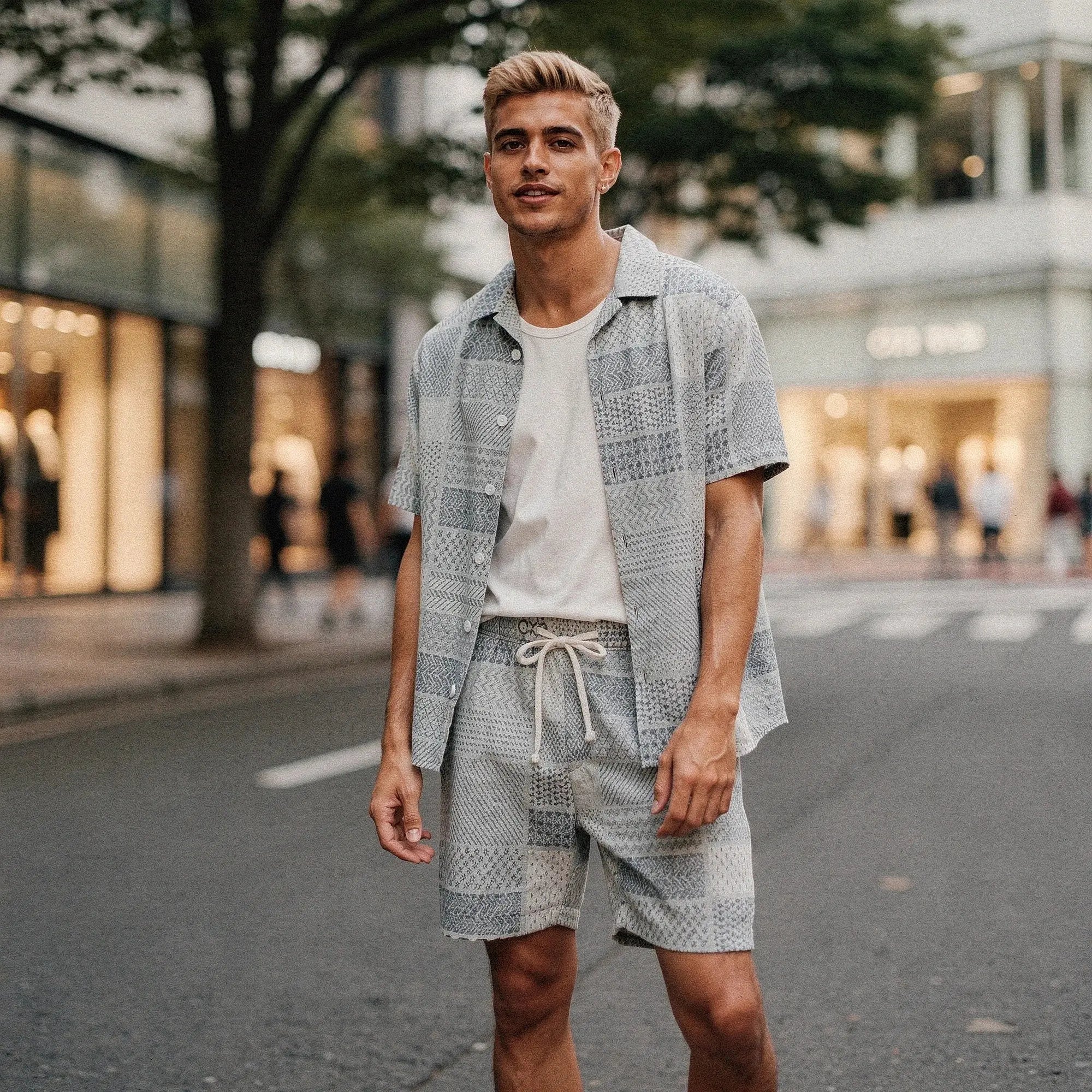 Light blue short sleeve button up resort shirt featuring a relaxed fit and subtle texture, view showcasing collar and buttons