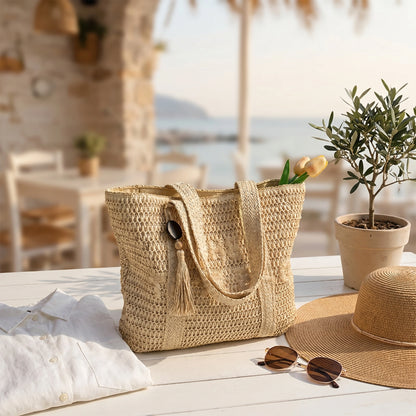 Close up of the woven straw tote bag showing intricate stitching and texture, set against a neutral background to highlight its design.
