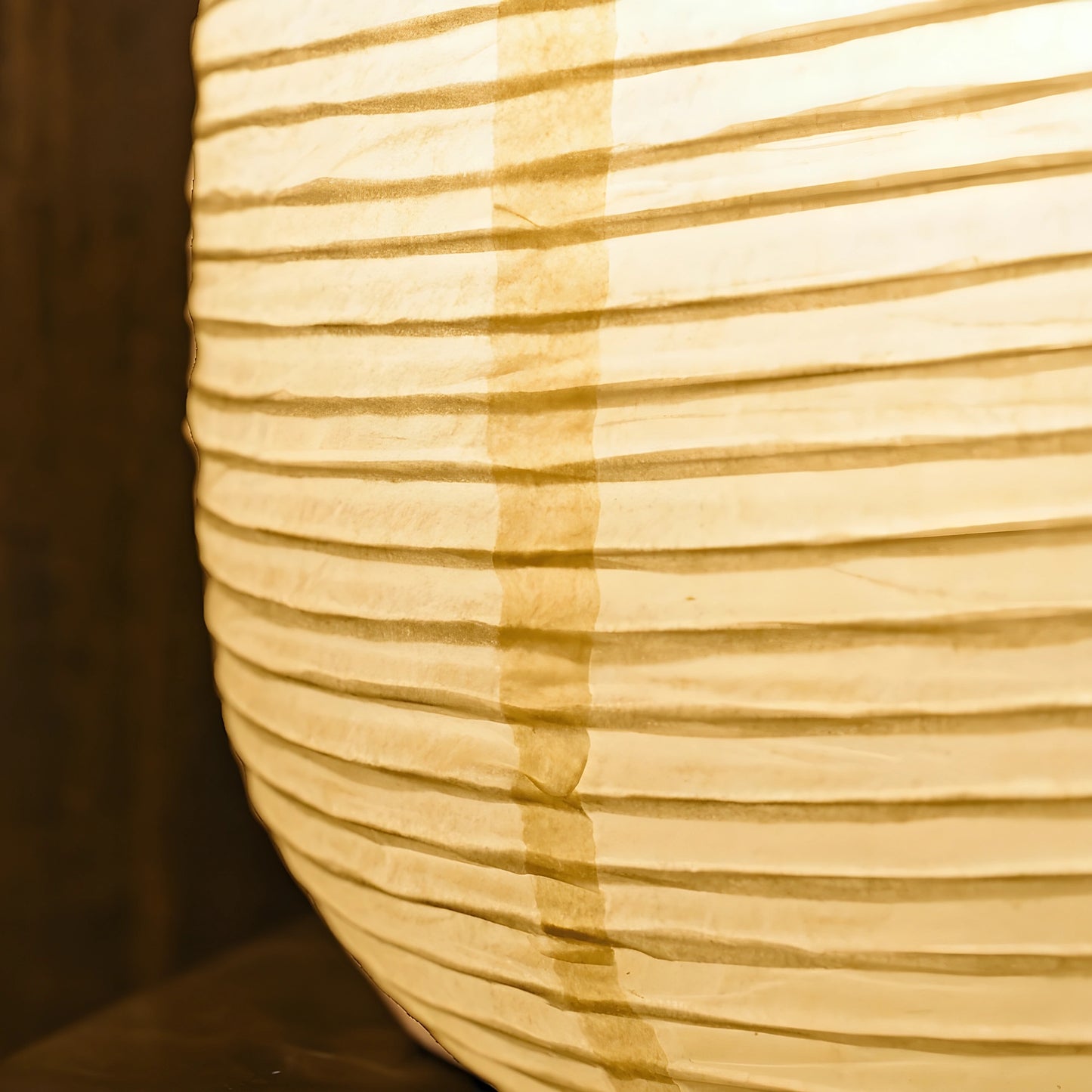 View of a serene minimalist rice paper table lamp featuring a soft white shade and a natural wood base, ideal for living room decor