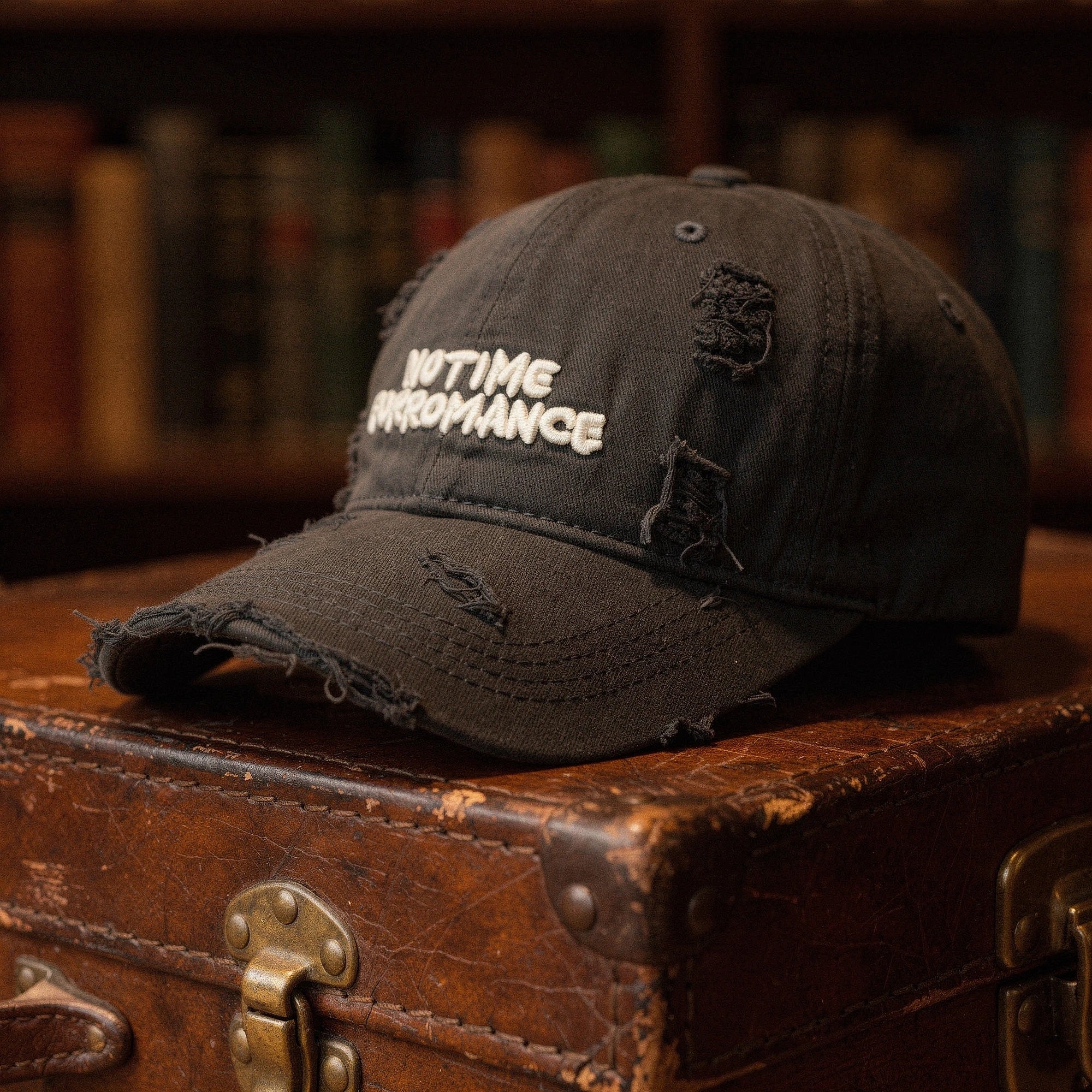 Light blue distressed baseball cap with adjustable strap, featuring a relaxed fit and subtle frayed details, view