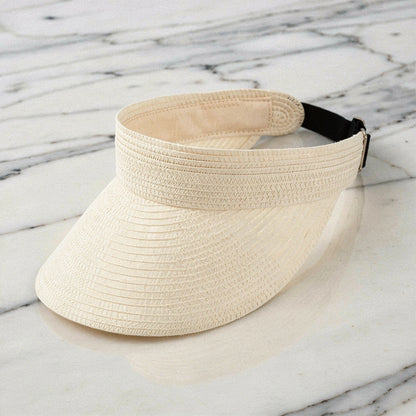 Lightweight straw visor hat in beige with a wide brim and a stylish bow , view