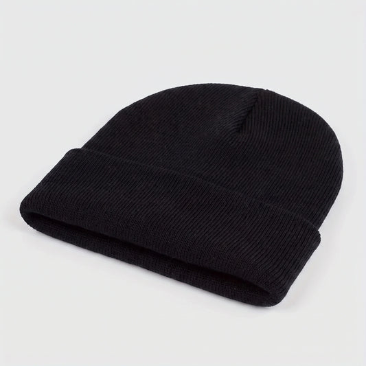 A model showcases the Mens Casual Warm Winter Beanie in a cozy outfit, showing neutral tones against a soft outdoor backdrop, perfect for winter adventures.