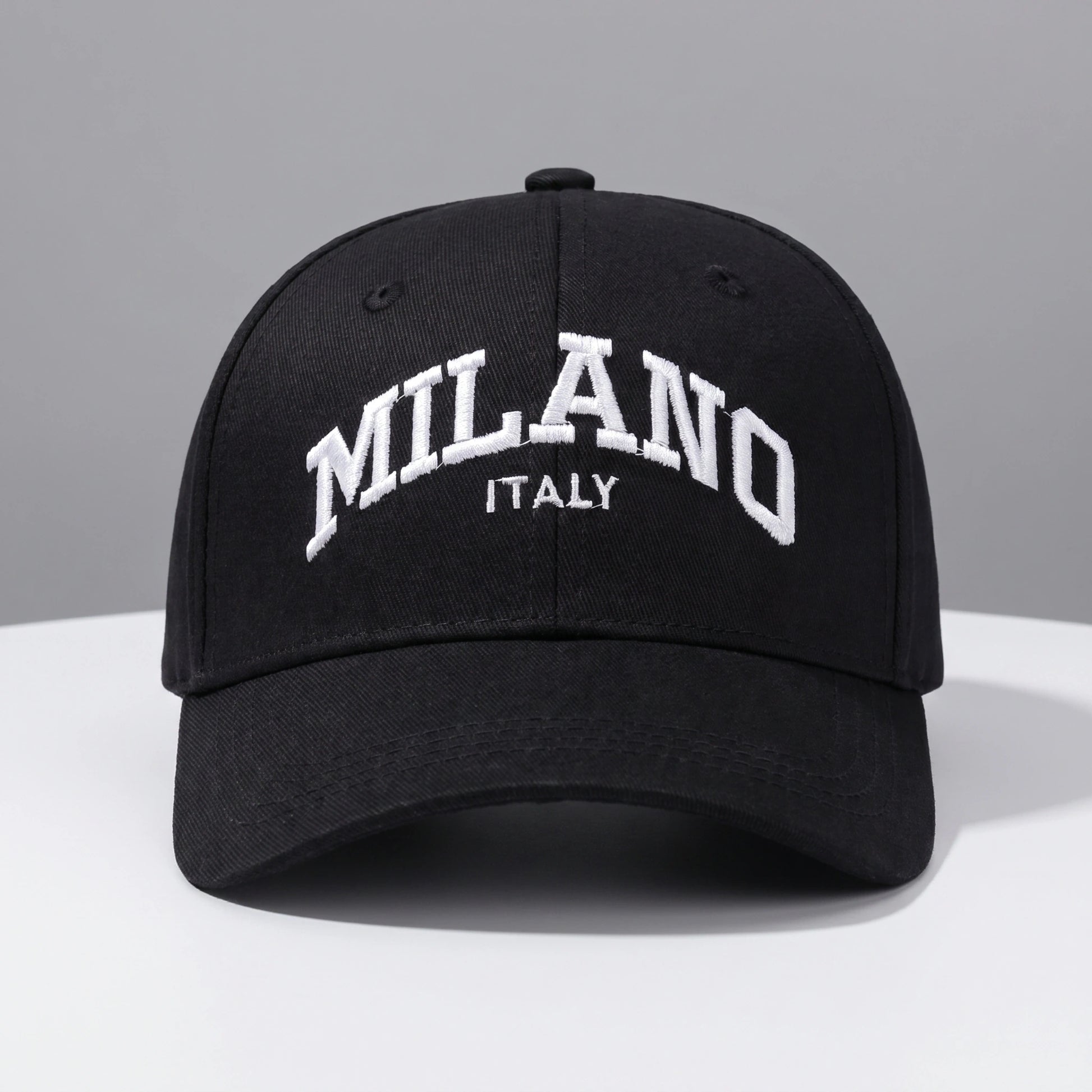 Back view of a adjustable embroidered baseball cap showing its durable construction and design, set against a neutral outdoor background.