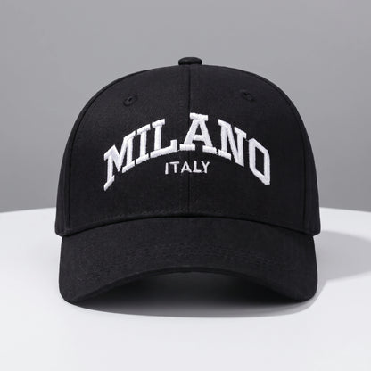Back view of a adjustable embroidered baseball cap showing its durable construction and design, set against a neutral outdoor background.