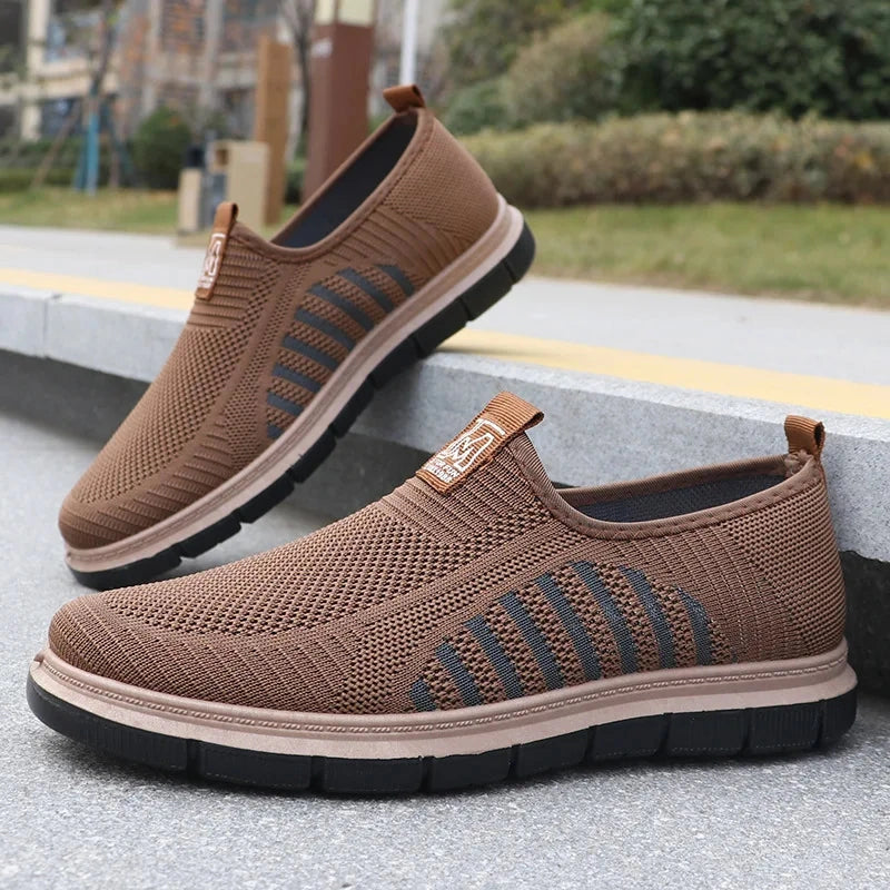 View of stylish knit upper shoes in dark gray, featuring a sleek design and comfortable fit