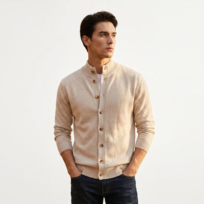 A model showcases a mens button down ribbed knit sweater in a classic navy color, styled with tailored trousers against a neutral background.