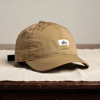 View of a stylish breathable baseball cap in dark navy, featuring a structured design and adjustable strap