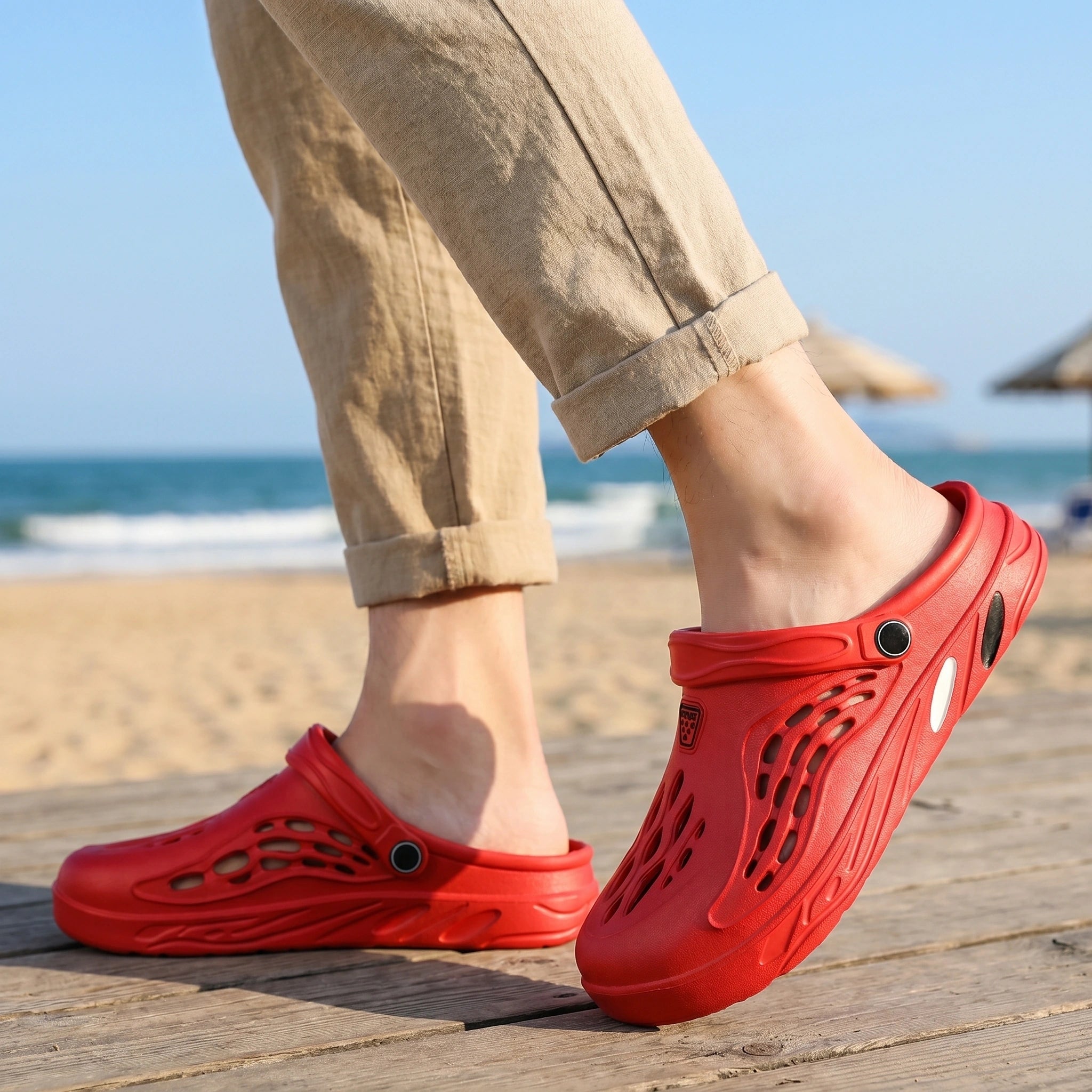 Back view of men's relaxed versatile summer sandals showing premium construction details, showing a neutral color palette against a soft outdoor background.