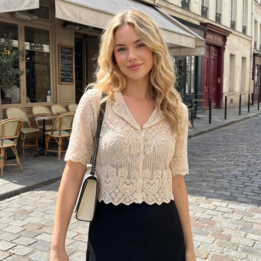 Back view of a model showing the Womens Sheer Boho Summer Blouse in soft white, showing its delicate fabric and intricate construction details against a neutral background.