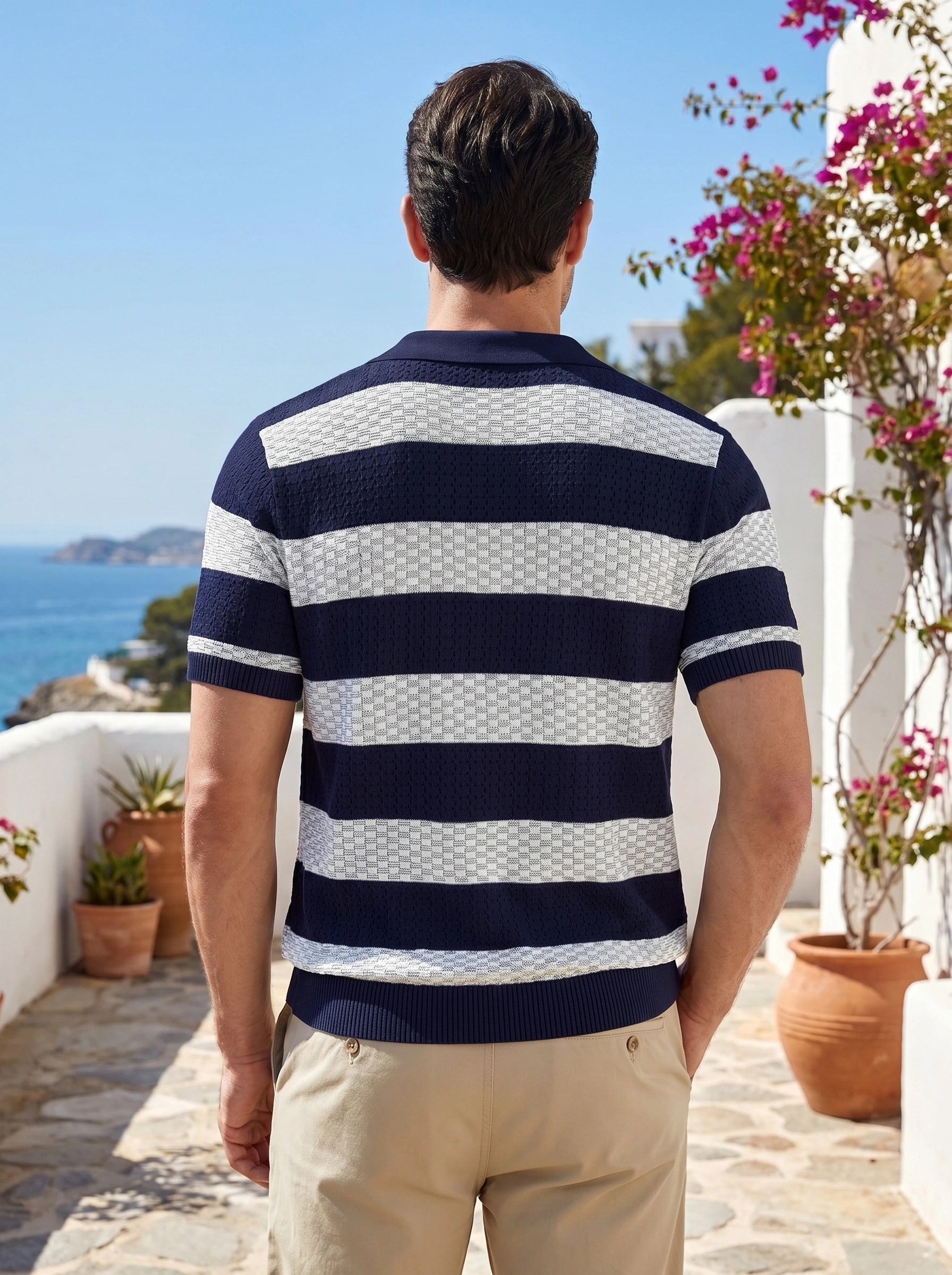 Close up view of the lightweight fabric and precise stitching of the men's summer polo in a colorful, showing its quality and design details.
