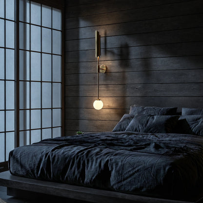 View of a brass wall sconce featuring dual light bulbs and a refined Nordic design, highlighting its elegant curves and warm finish