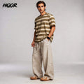 View of relaxed lightweight summer trousers in light beige, made