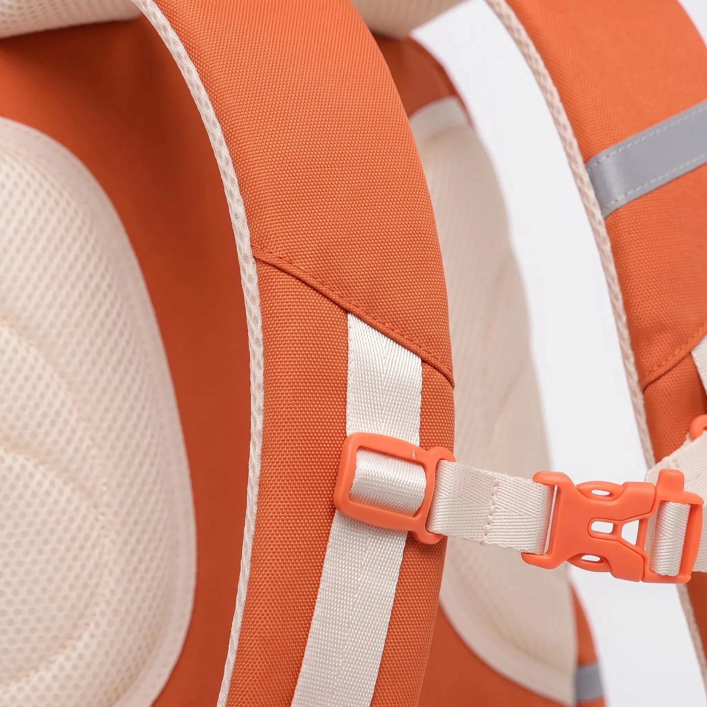 Detailed view of a structured ergonomic nylon school backpack in vibrant blue, showcasing padded shoulder straps and multiple compartments