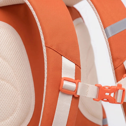 Detailed view of a structured ergonomic nylon school backpack in vibrant blue, showcasing padded shoulder straps and multiple compartments
