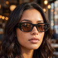 Close up view of the Womens Retro Oversized Sunglasses showing intricate detailing and stitching against a soft, neutral background, perfect for a vintage inspired look.