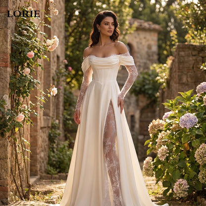 A model showcases the Womens Understated Wedding Dress in a soft ivory hue, showing delicate lace detailing and a flowing silhouette against a neutral background.