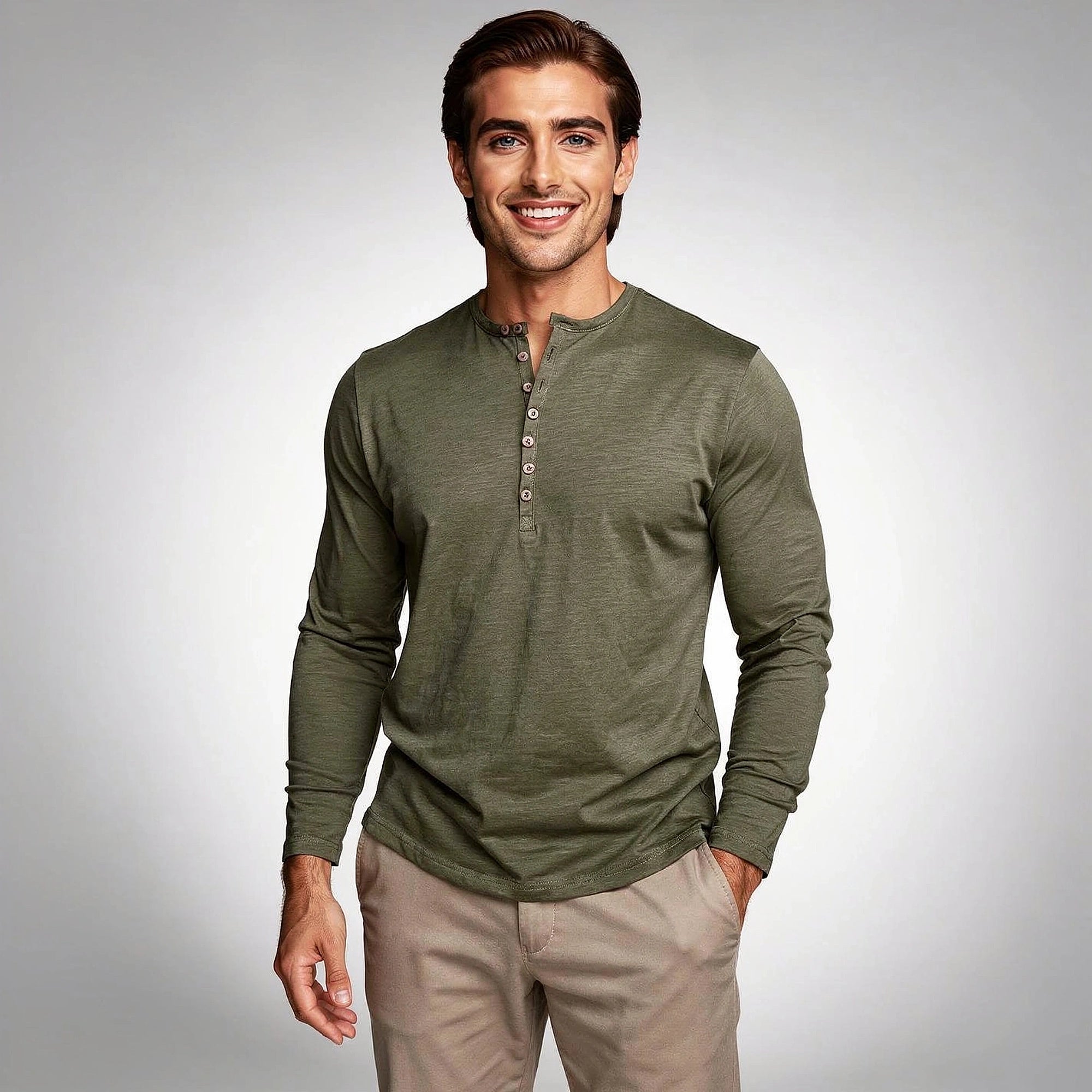 View of a light gray long sleeve henley shirt made of soft cotton, featuring a three button placket and ribbed cuffs