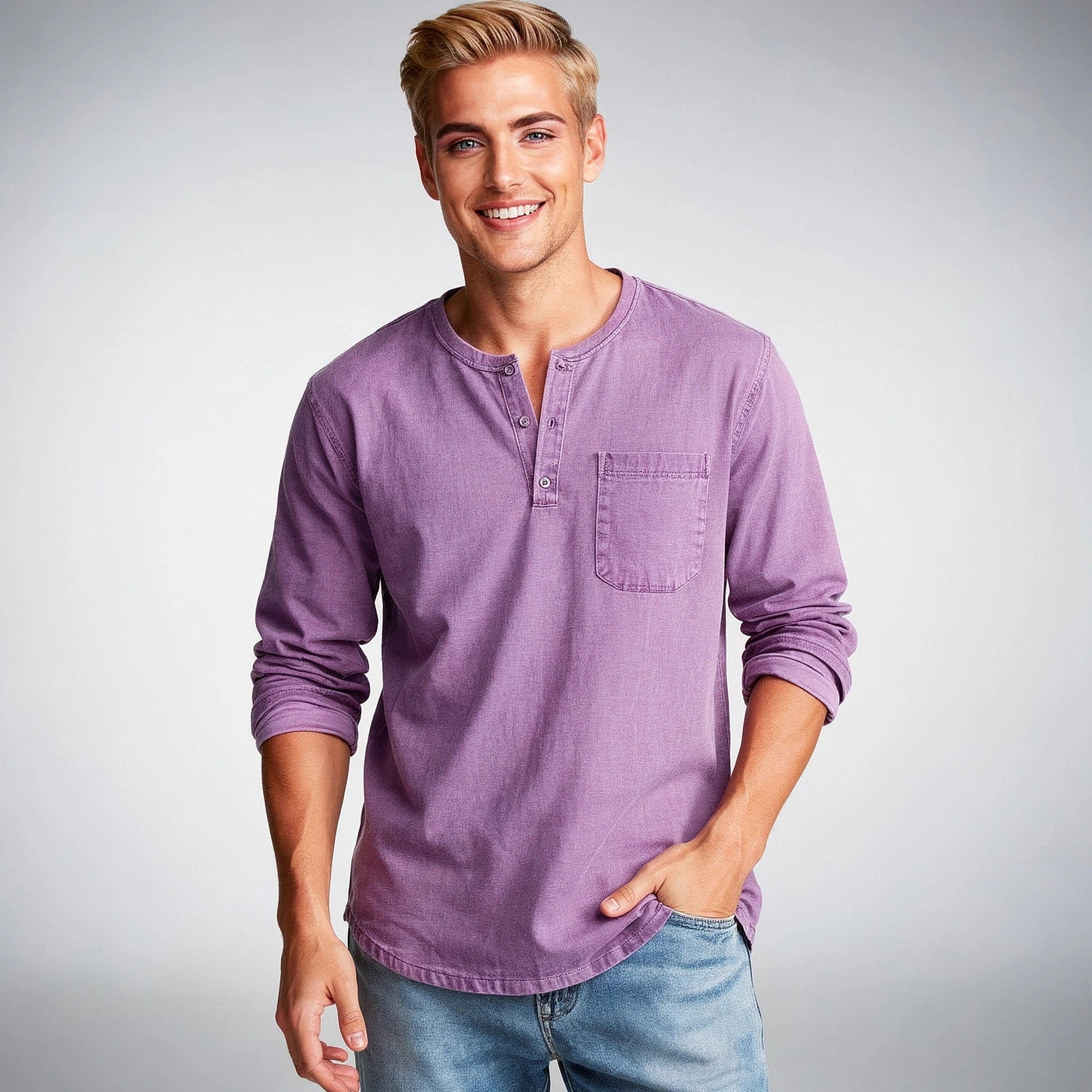 View of a light gray long sleeve henley shirt made from soft cotton, featuring a three button placket and ribbed cuffs