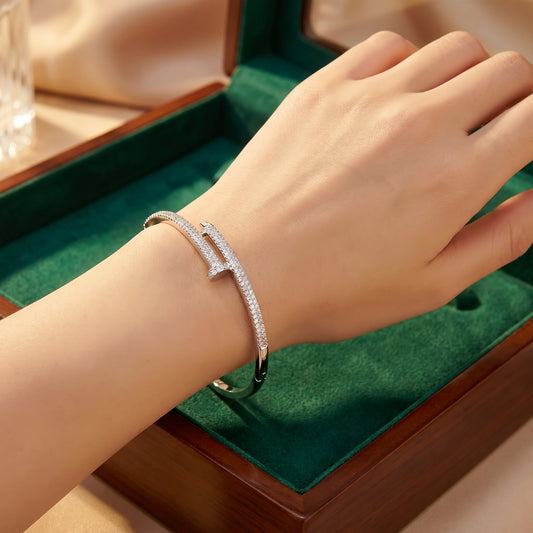 Close up of the Womens Sparkling Bracelet showing its intricate design and shimmering stones against a soft, neutral background.