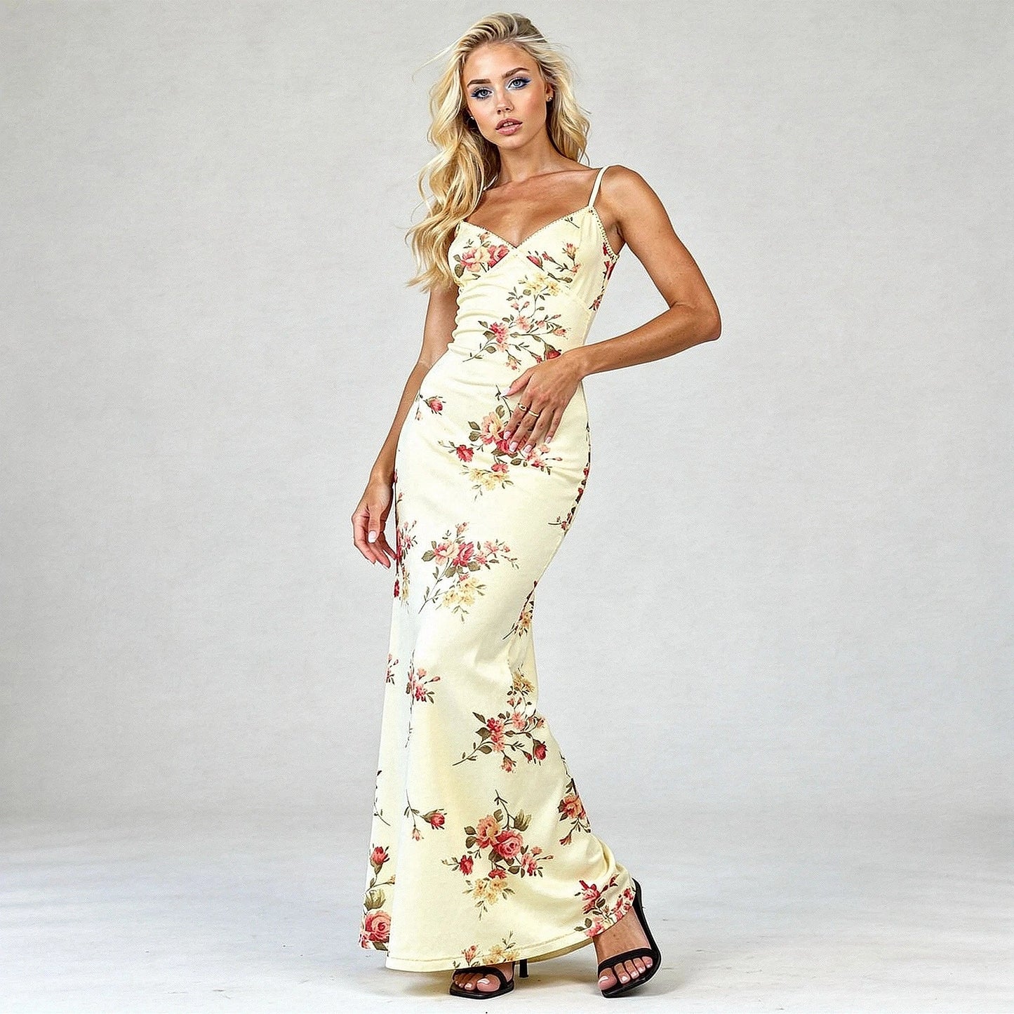 View of a women's elegant bodycon maxi dress featuring a vibrant floral print and a fitted silhouette