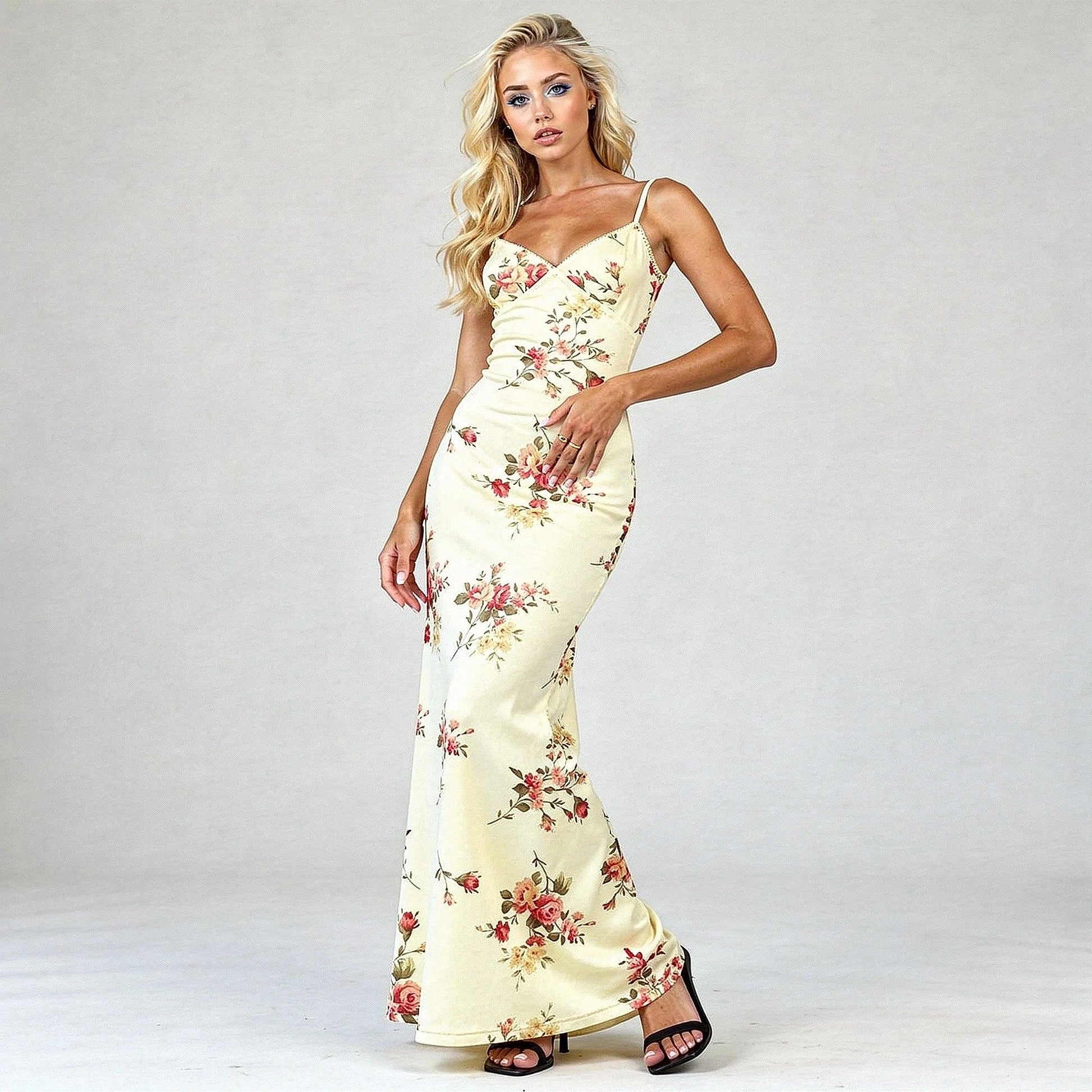 View of a women's elegant bodycon maxi dress featuring a vibrant floral print and a fitted silhouette