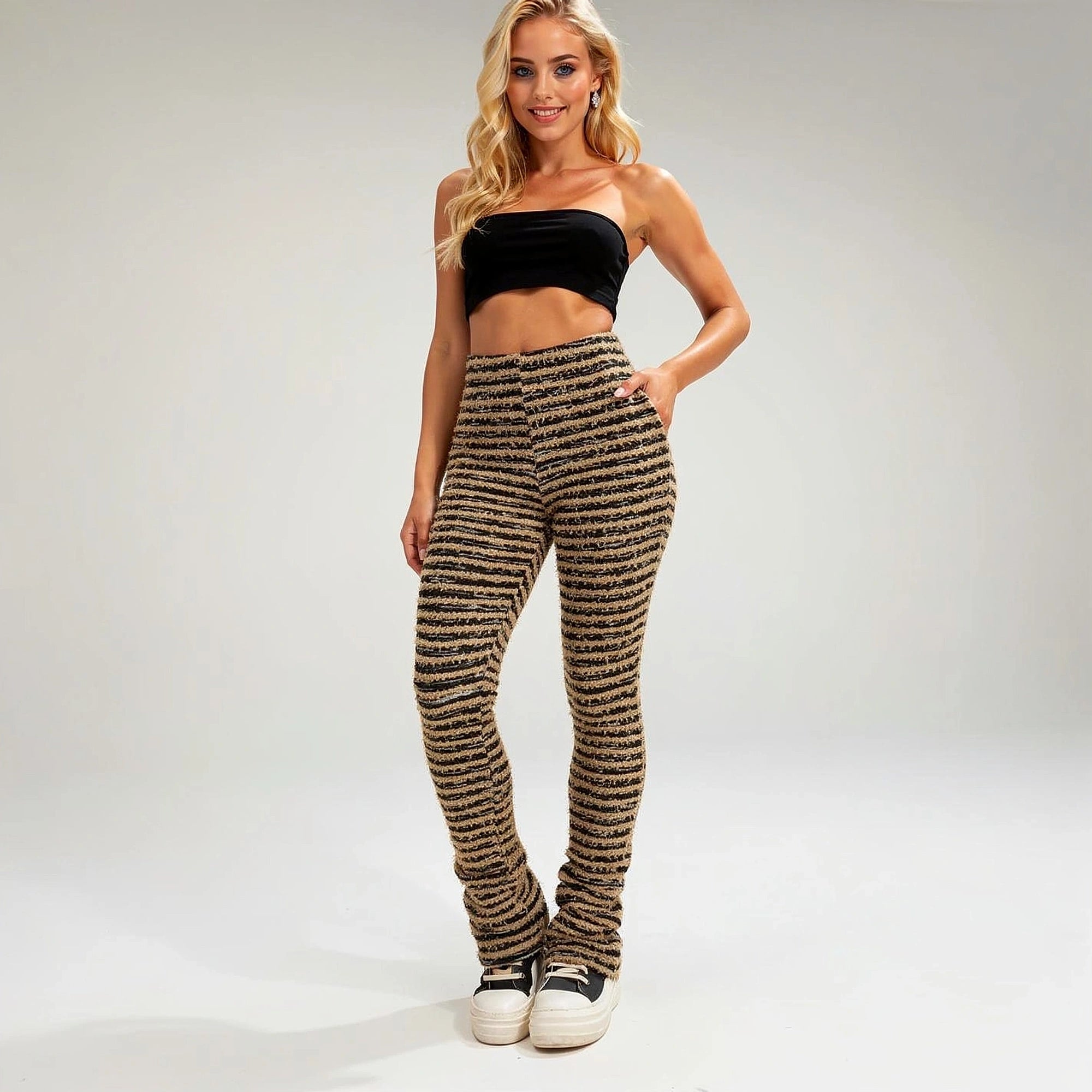 View of soft stretch trousers in light gray fabric, featuring an elastic waistband and pockets