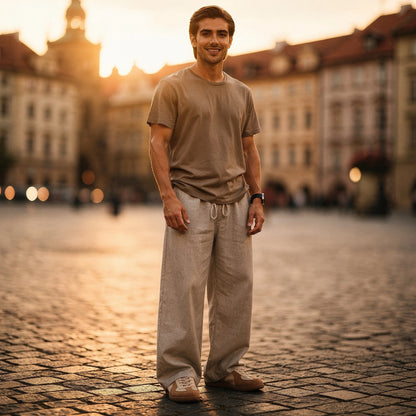Lightweight summer trousers in a soft beige fabric, featuring a relaxed fit and pockets, view showcasing texture