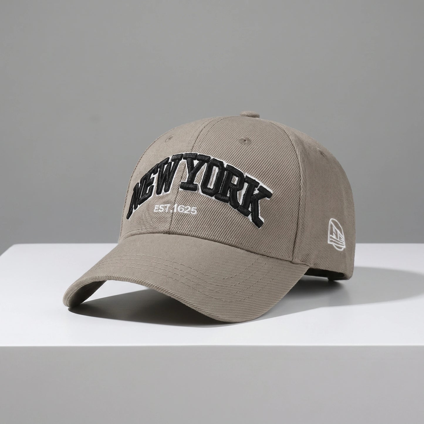 Close up view of the adjustable polyester baseball cap showing intricate stitching and fabric texture, ideal for outdoor adventures in spring and autumn.
