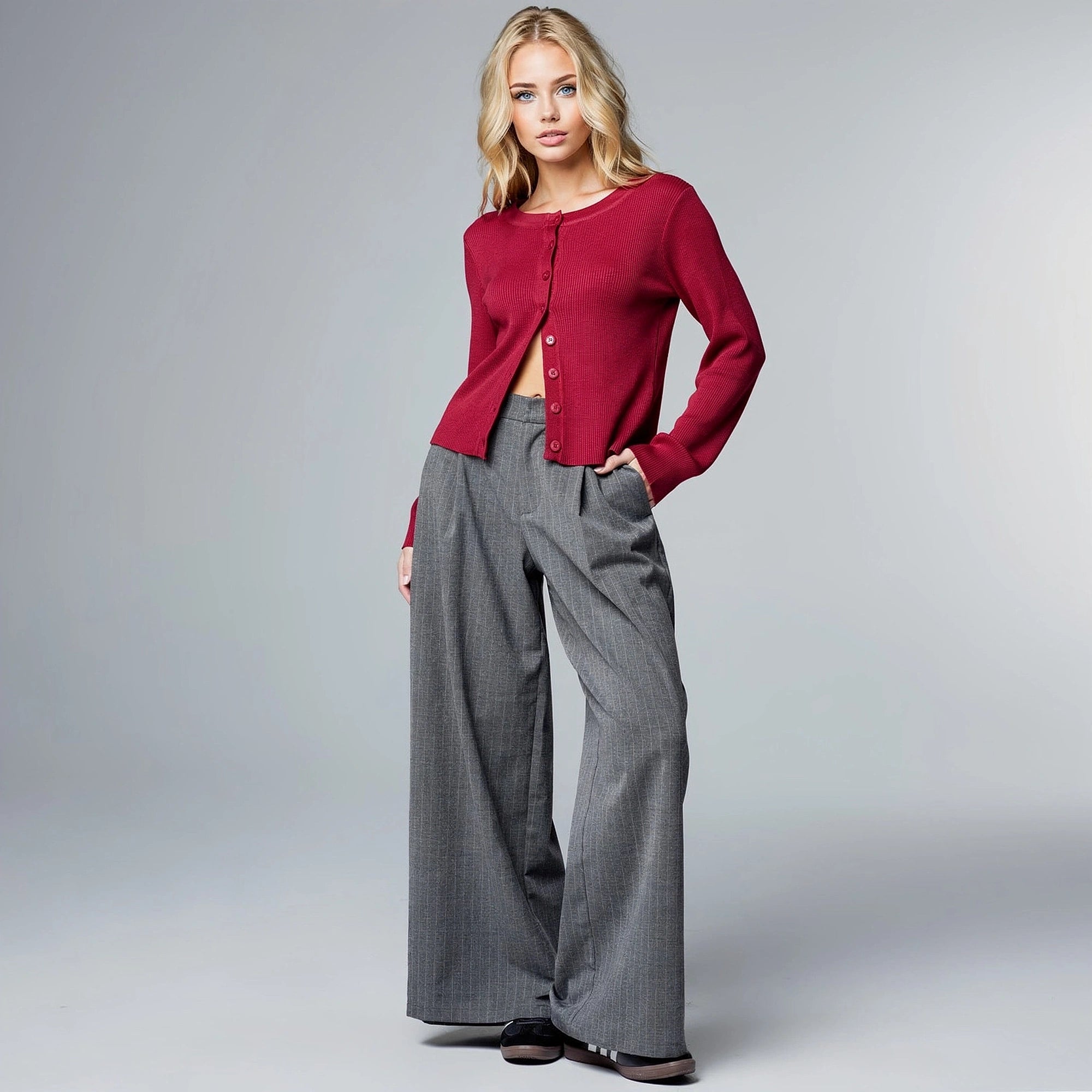 View of high waist trousers in soft beige fabric, featuring a tailored fit and subtle pleats