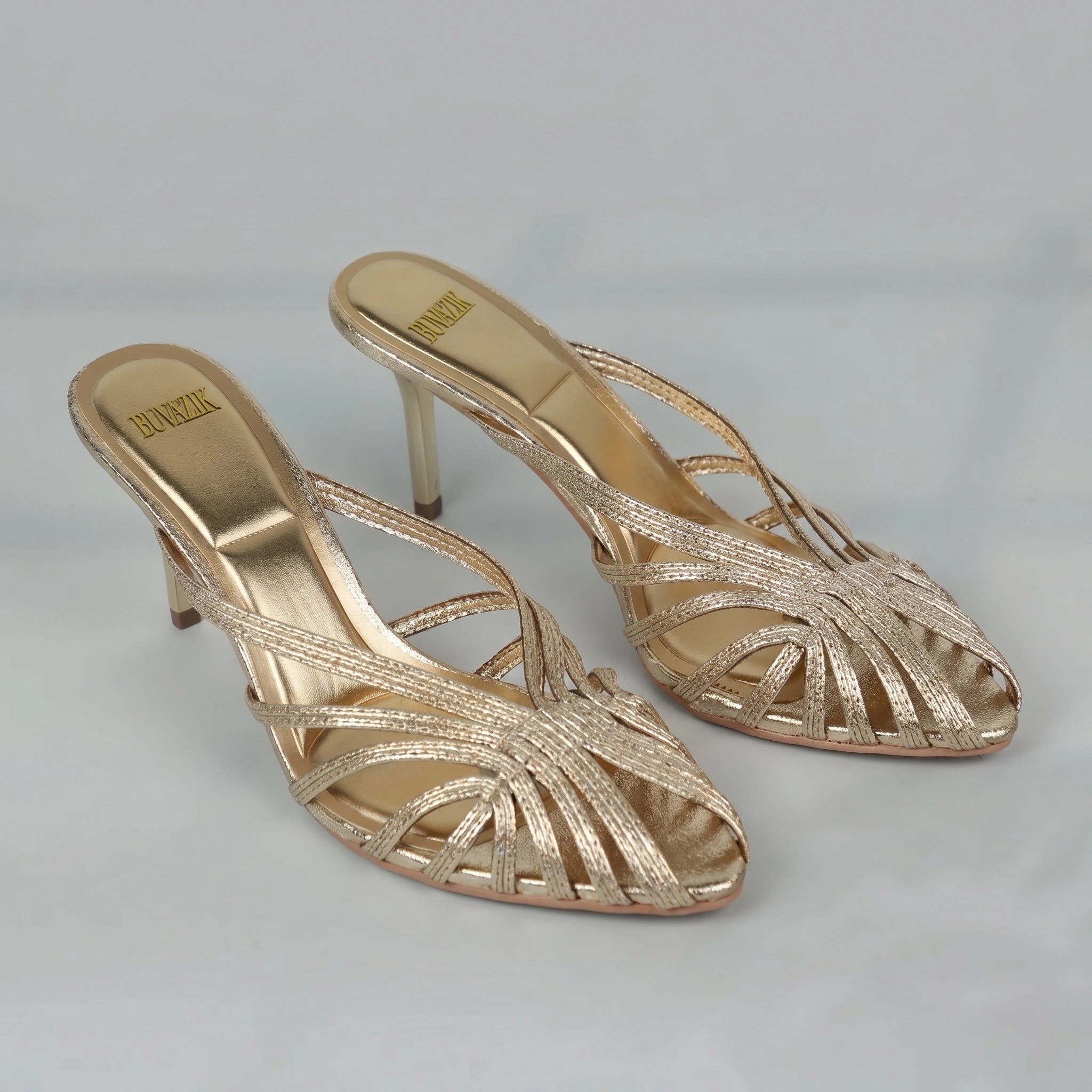 Back view of a model showing the Womens Sleek Summer Heeled Pumps in a soft nude color, showing the shoe's refined construction and silhouette against a neutral background.