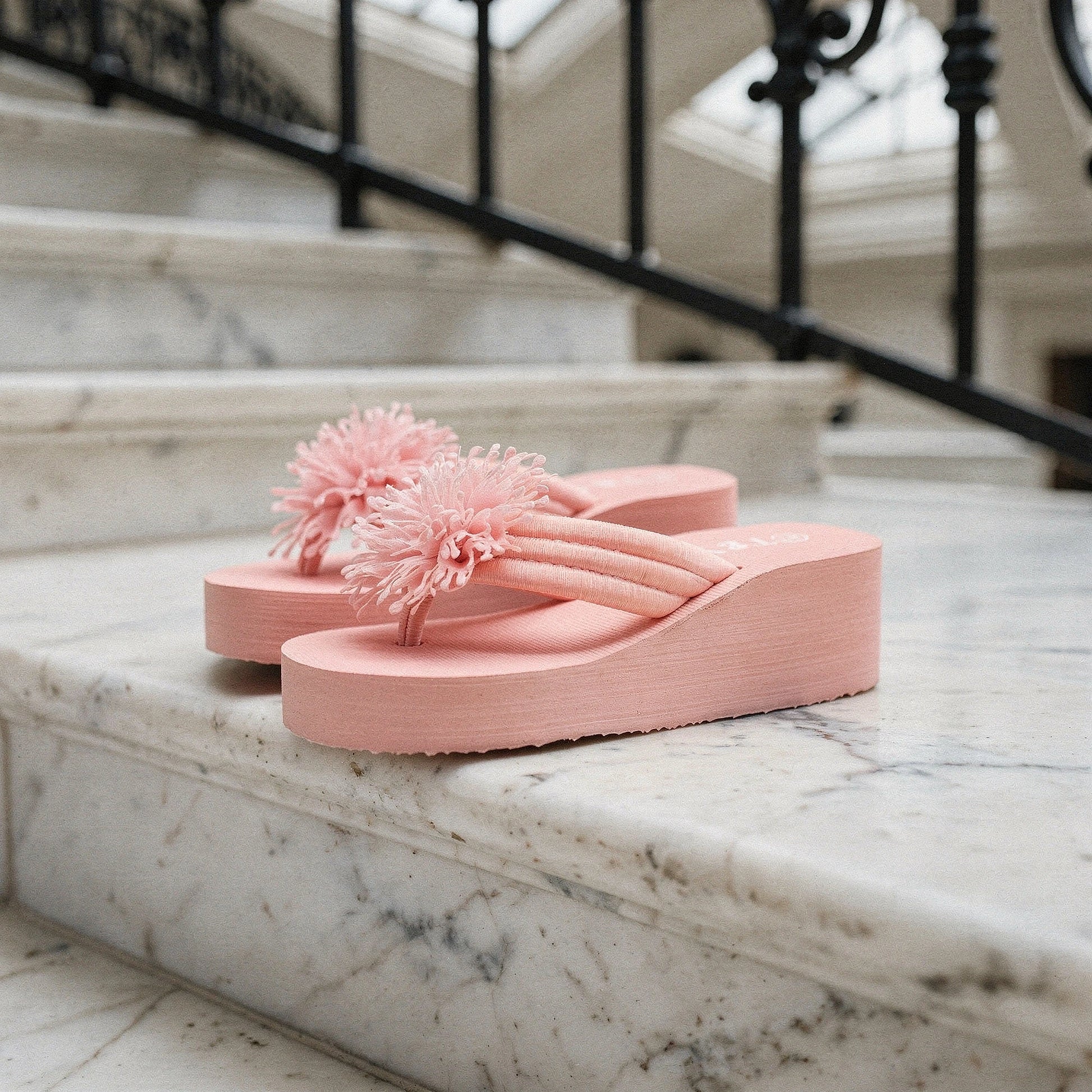 View of charming floral EVA wedge sandals featuring a vibrant floral pattern, soft cushioning, and a stylish wedge heel