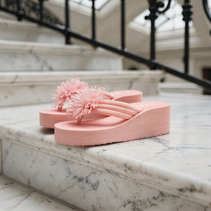 View of charming floral EVA wedge sandals featuring a vibrant floral pattern, soft cushioning, and a stylish wedge heel