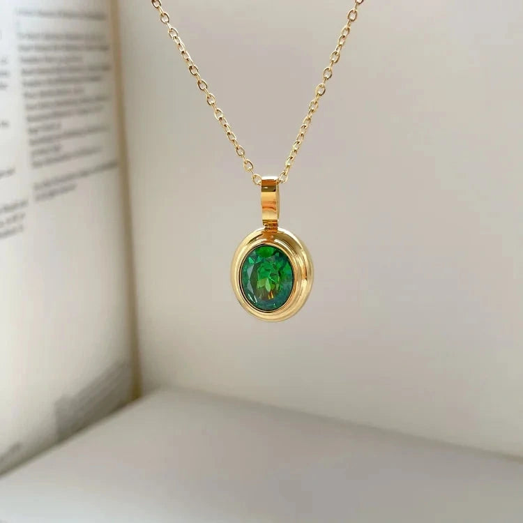 View of a vintage necklace featuring a delicate chain and a central peridot gemstone, showcasing its refined design and elegant color
