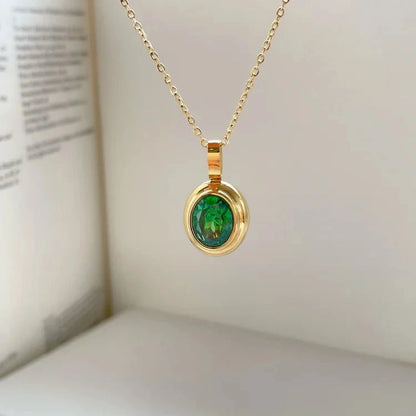 View of a vintage necklace featuring a delicate chain and a central peridot gemstone, showcasing its refined design and elegant color
