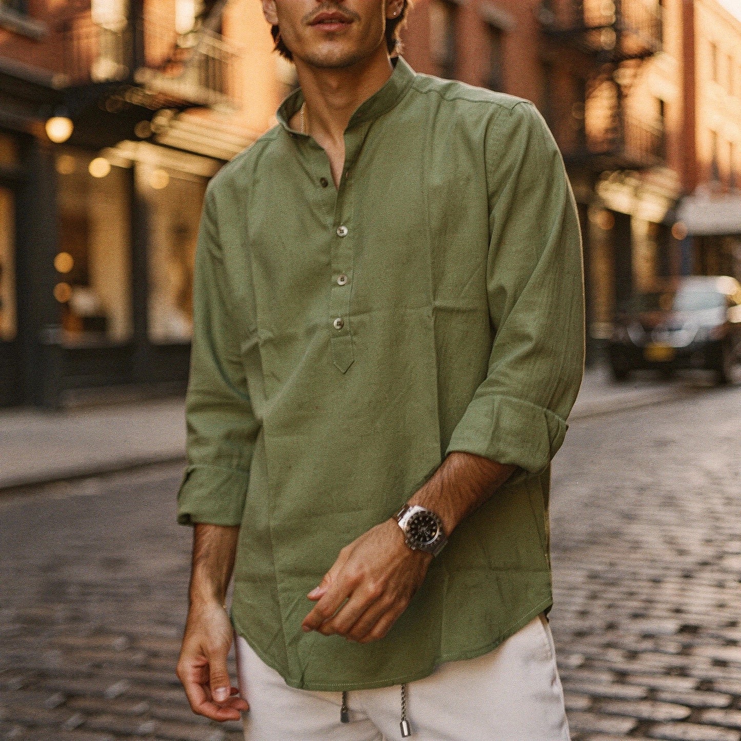 Lightweight summer henley shirt in light blue, featuring a three button placket and short sleeves, view