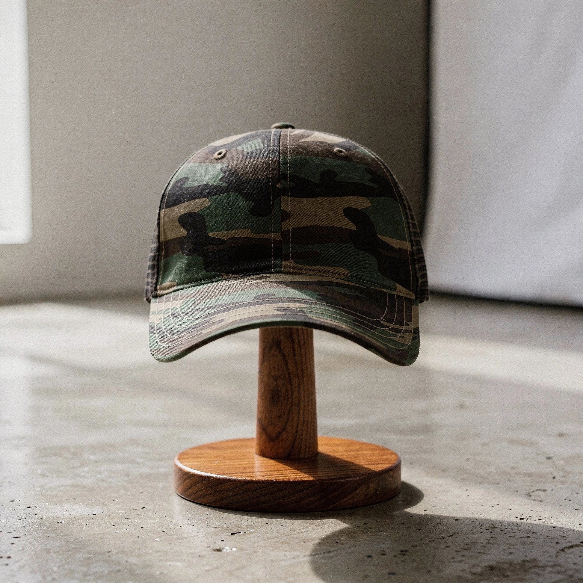 View of a relaxed vintage snapback cap in dark gray with a classic flat brim and adjustable strap