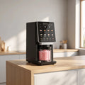 View of a compact ice cream maker featuring a sleek touchscreen interface and eight preset options for easy operation