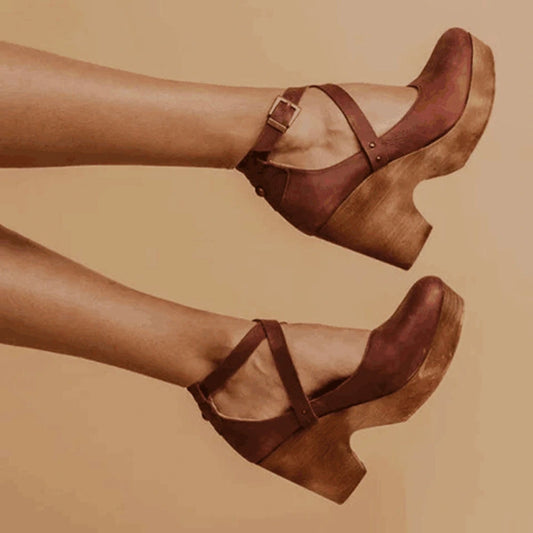 View of elegant summer sandals in soft beige leather, featuring a stylish buckle and a comfortable flat sole