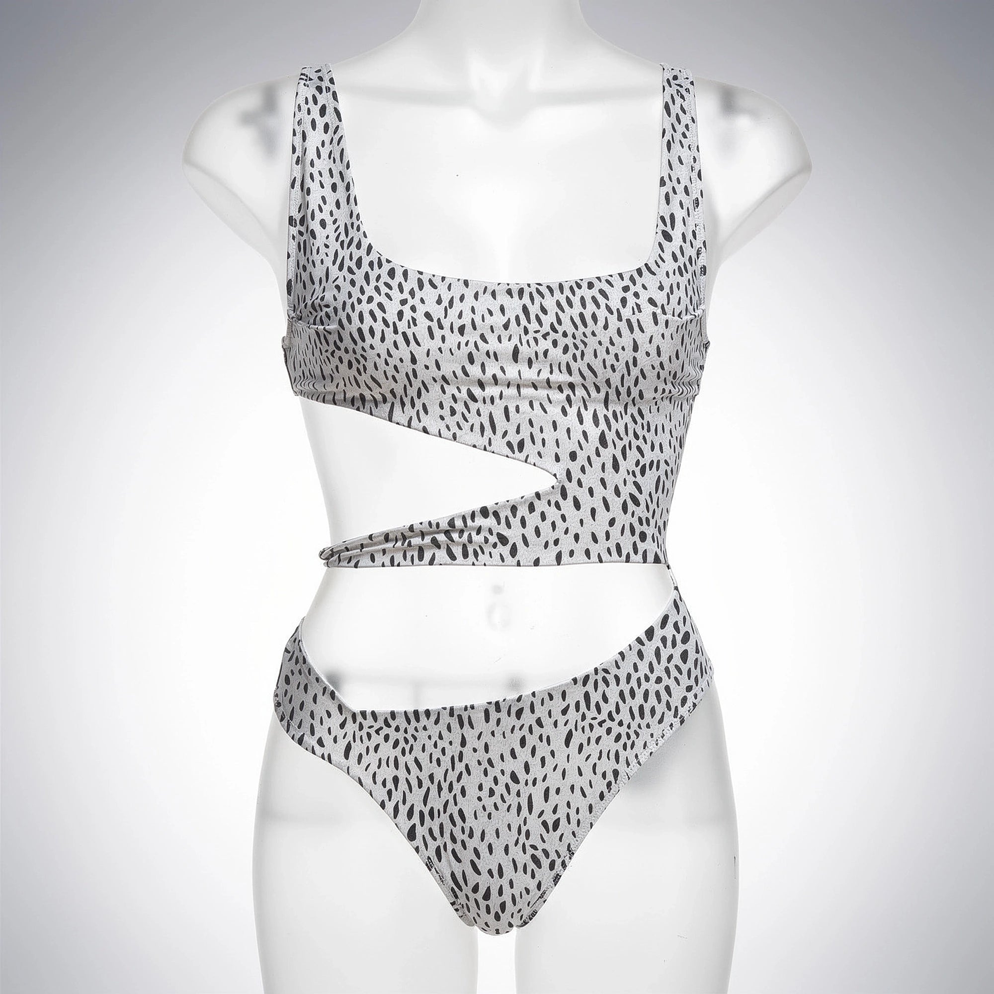 Black one piece swimsuit featuring a plunging neckline and cut out sides, detailed view showcasing fabric texture and design