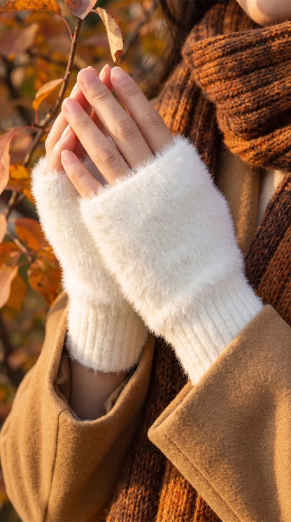 Back view of women's cozy protective autumn gloves showing their construction details, with a soft fabric in a rich burgundy hue against a neutral backdrop.
