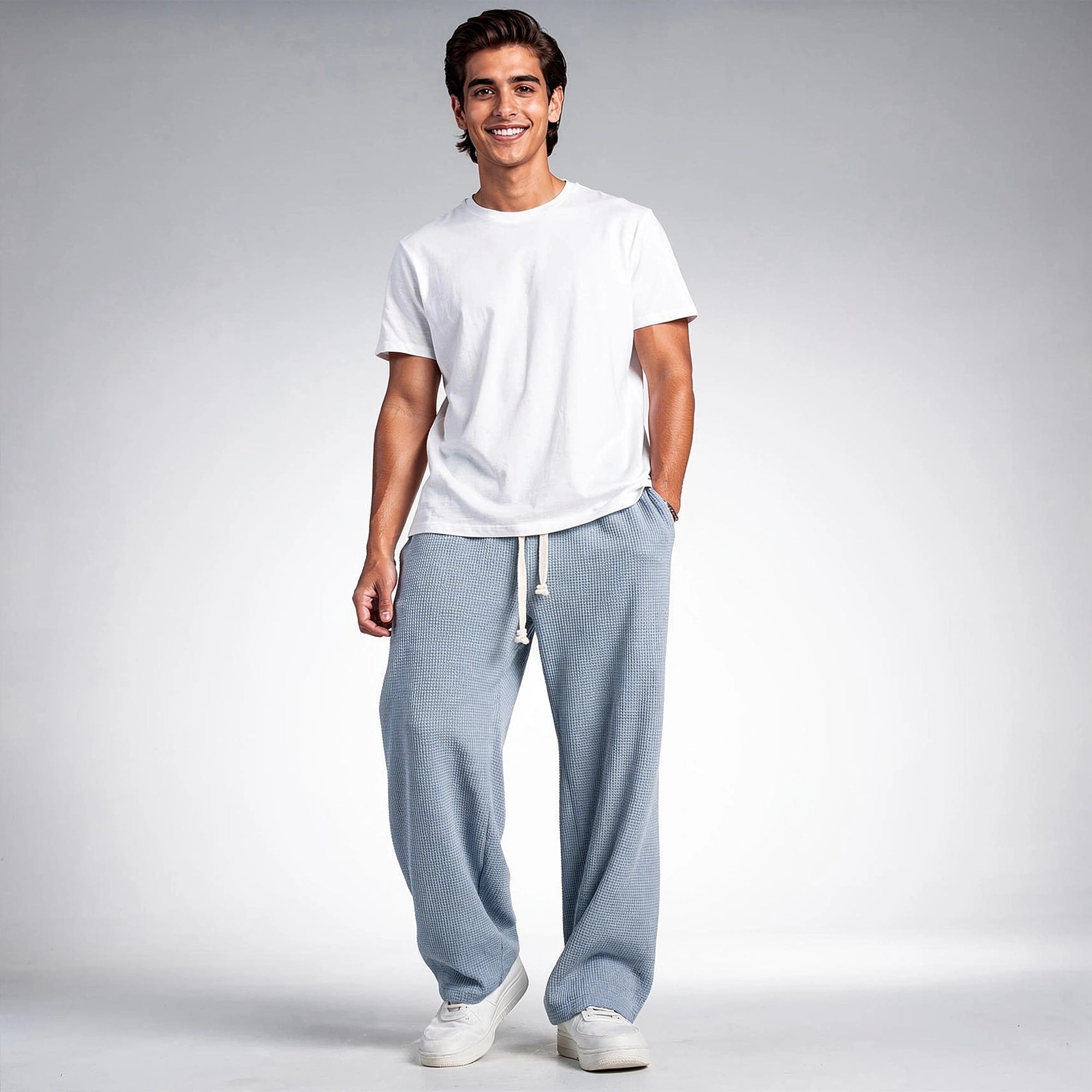 Light gray relaxed fit drawstring pants with a comfortable waistband and pockets, view