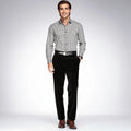 View of luxurious tailored velvet dress pants in deep green, featuring a sleek silhouette and refined finish