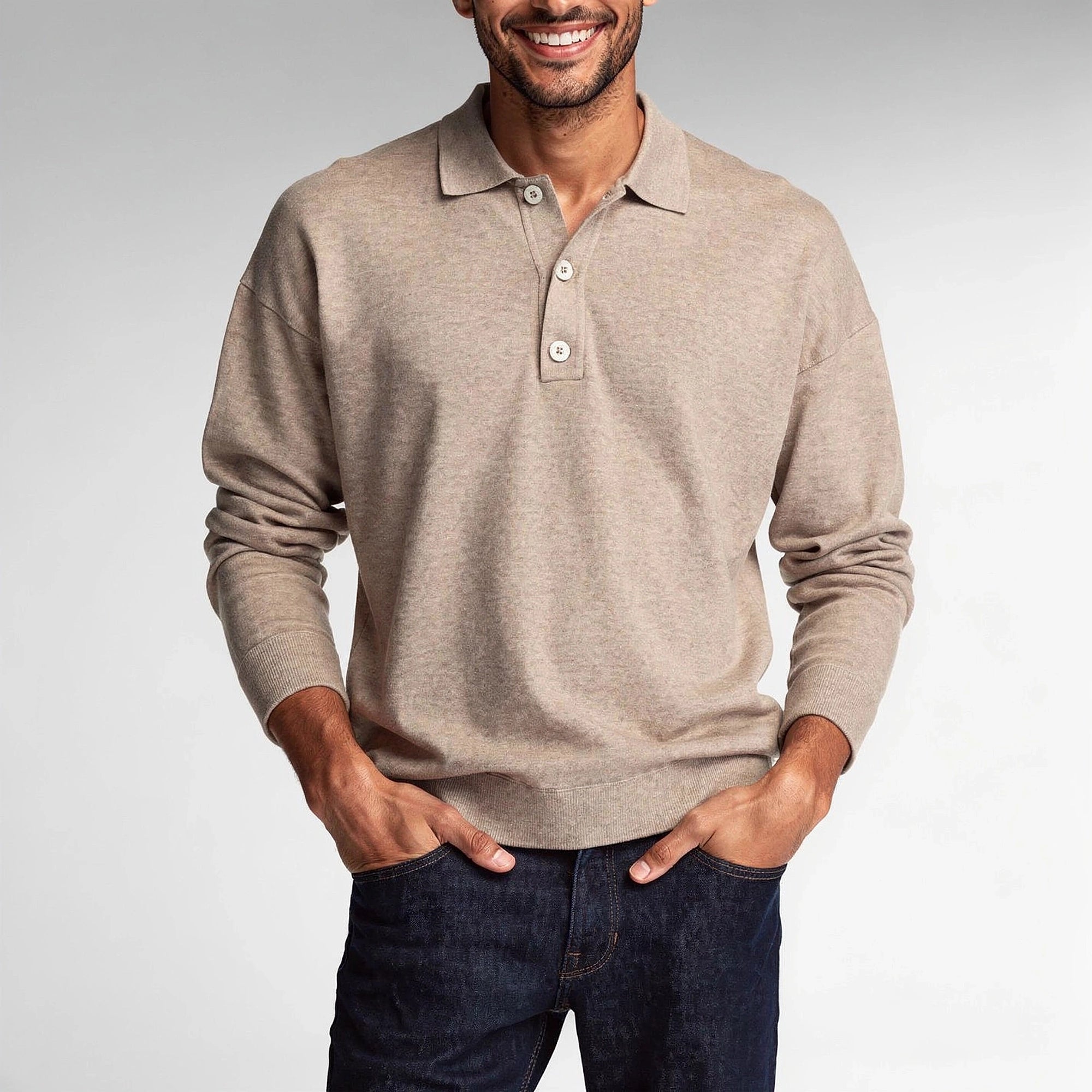 View of a light gray knit polo shirt featuring a classic collar and short sleeves, showcasing the soft fabric texture