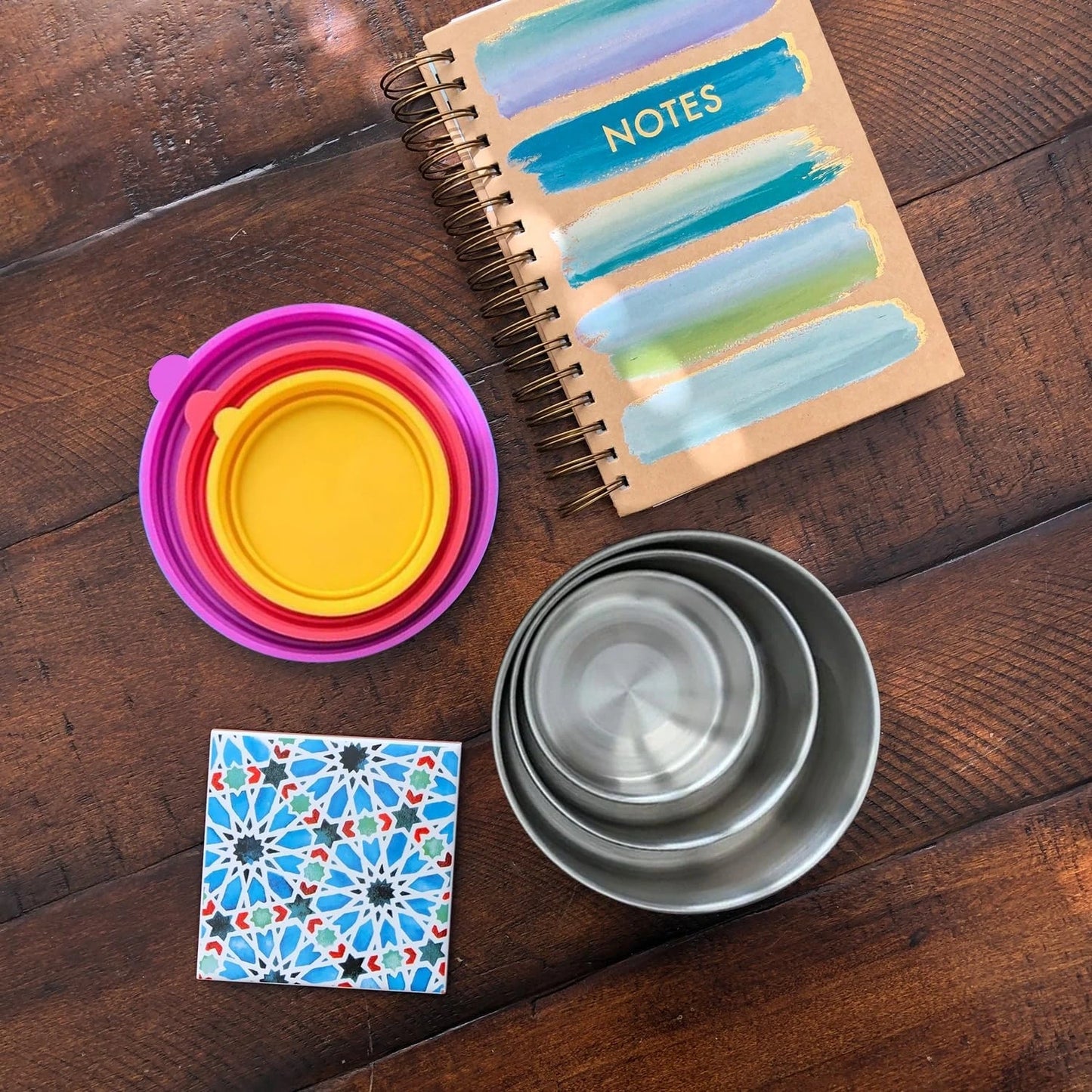 View of a sleek stainless steel lunch box set featuring secure lids, showcasing a polished silver finish and ergonomic design