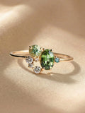 Elegant delicate zircon ring for women featuring a shimmering peridot stone, view showcasing its intricate design and craftsmanship