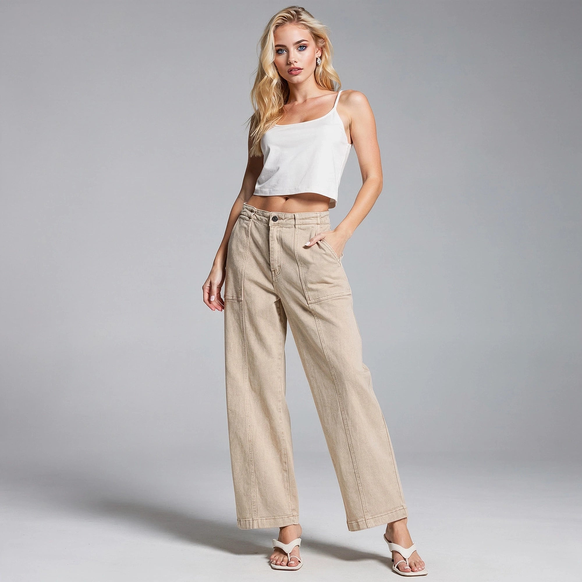 View of stylish utility straight leg jeans in a medium wash denim, featuring classic five pocket design and subtle stitching details