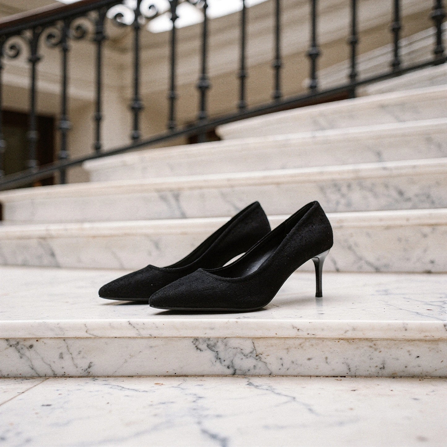 Elegant pointed mid heel sandals in soft beige leather, featuring a sleek design and ankle strap, detailed view